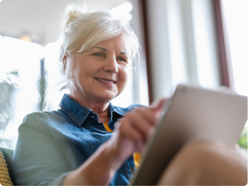 Woman reading mesothelioma guide on tablet